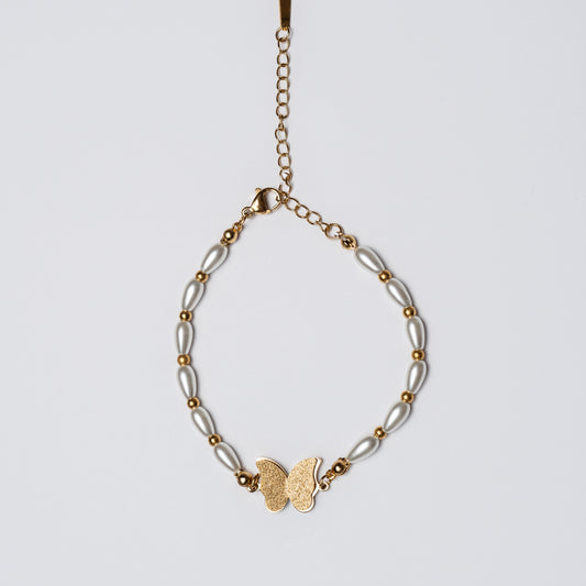 Pulsera Mariposa Elegante Con Perlas y Acabados Dorados.
